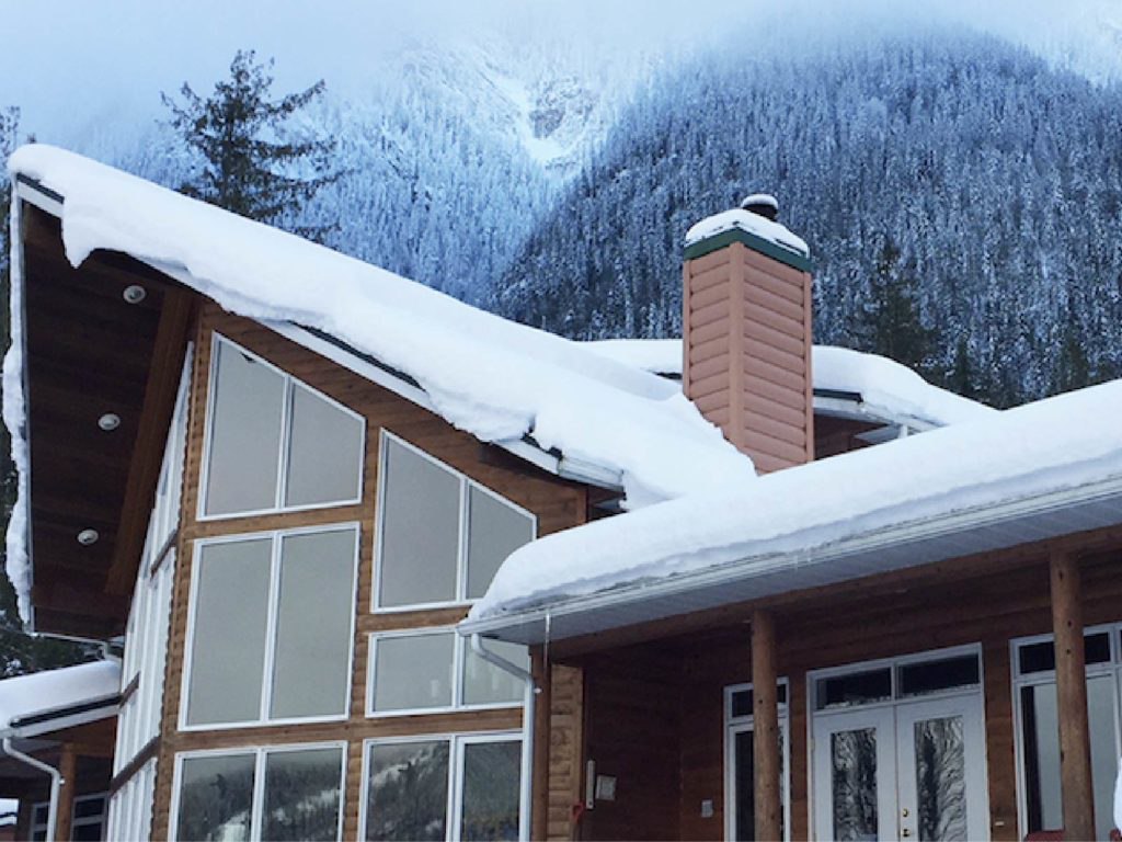Snow guards for exposed fastened metal roofs